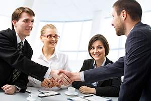 sales performance Consultant shaking a client hand