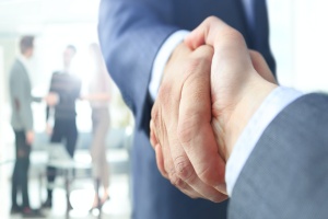 handshake after consultant working with a sales compensation consulting